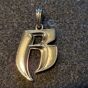 Stainless steel rhodium plated Ruf Riders pendant